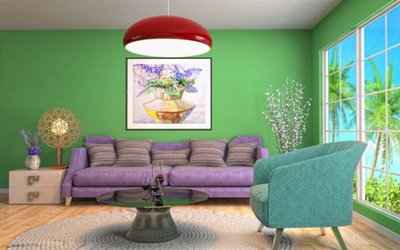 A cozy living room with purple furniture and green painted walls.