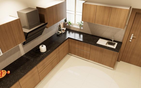 A kitchen with a sleek black counter top and warm wooden cabinets.